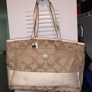 Beige Coach baby bag